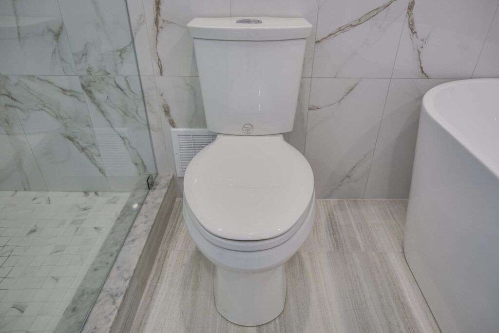 bathroom renovation installed tall white toilet