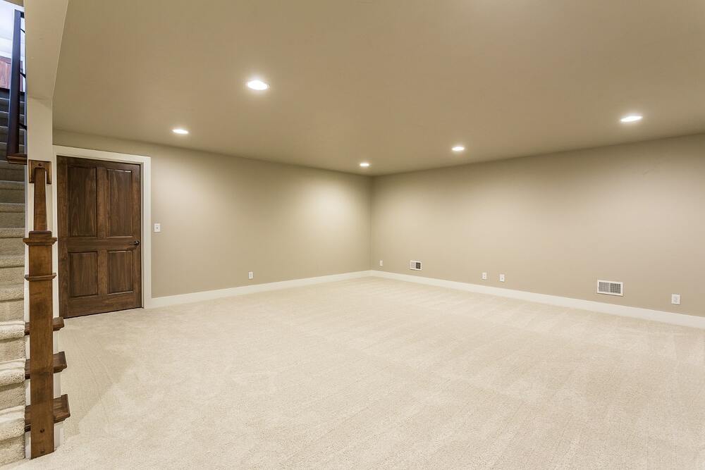 Spacious finished basement with soundproof ceiling and entertainment area