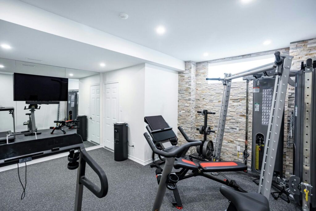 Basement renovation with Gym completed by RenoDuck. Photos