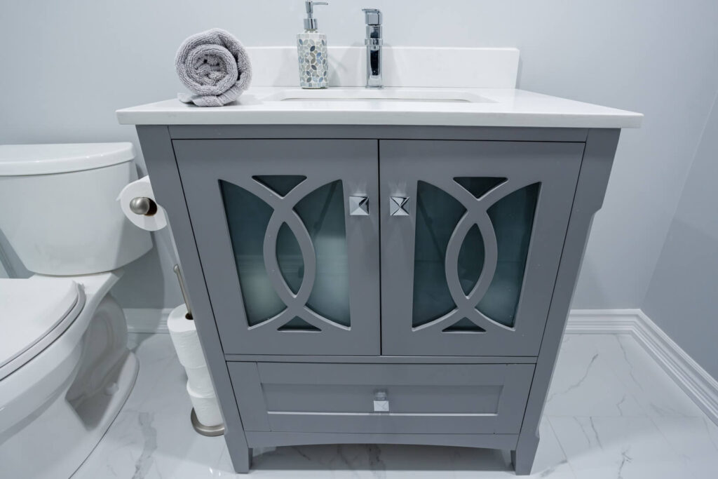 vanity cabinet glass door design with drawer and white countertop