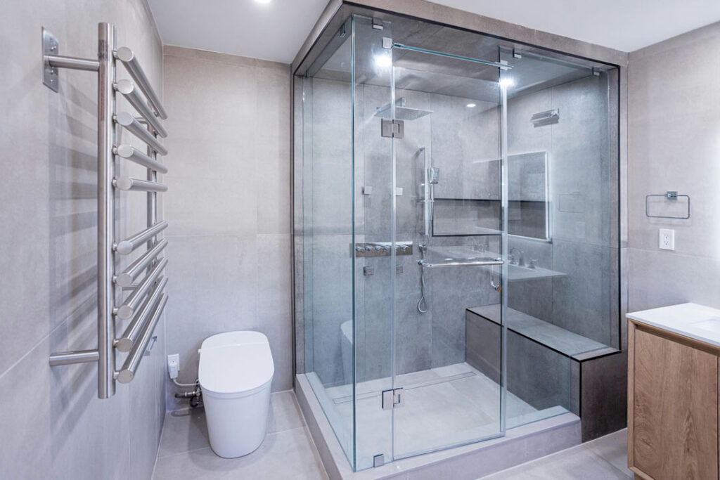 large modern bathroom renovation with corner shower unit with toilet seat