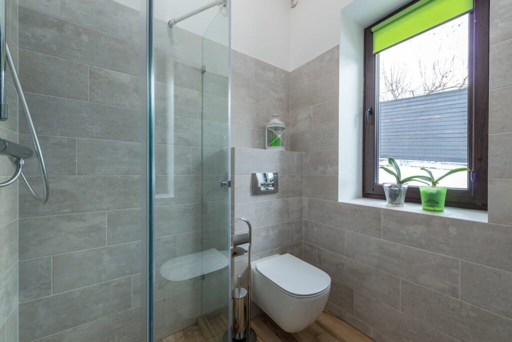 barrier free shower unit with toilet seat and faucets