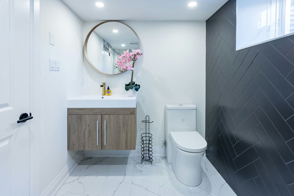 floating wooden vanity with white countertop and white toilet seat