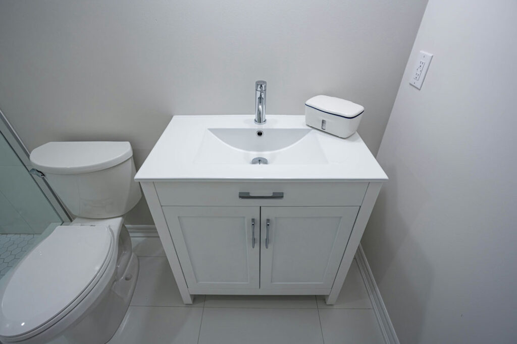 basement bathroom renovation with single vanity with countertop