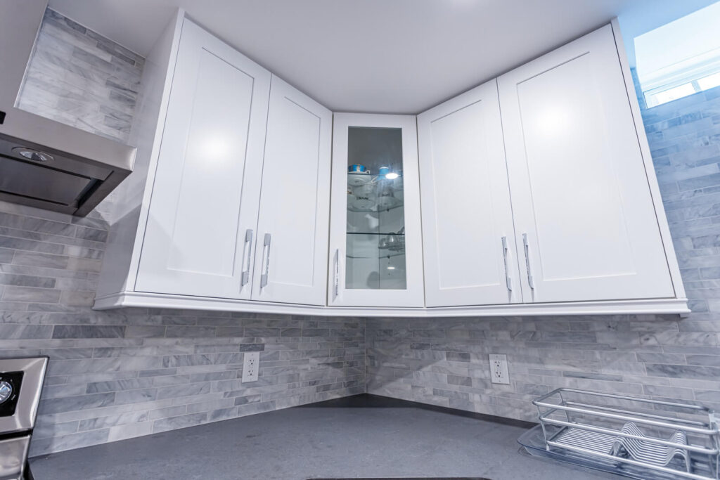 white storage cabinets with grey countertop