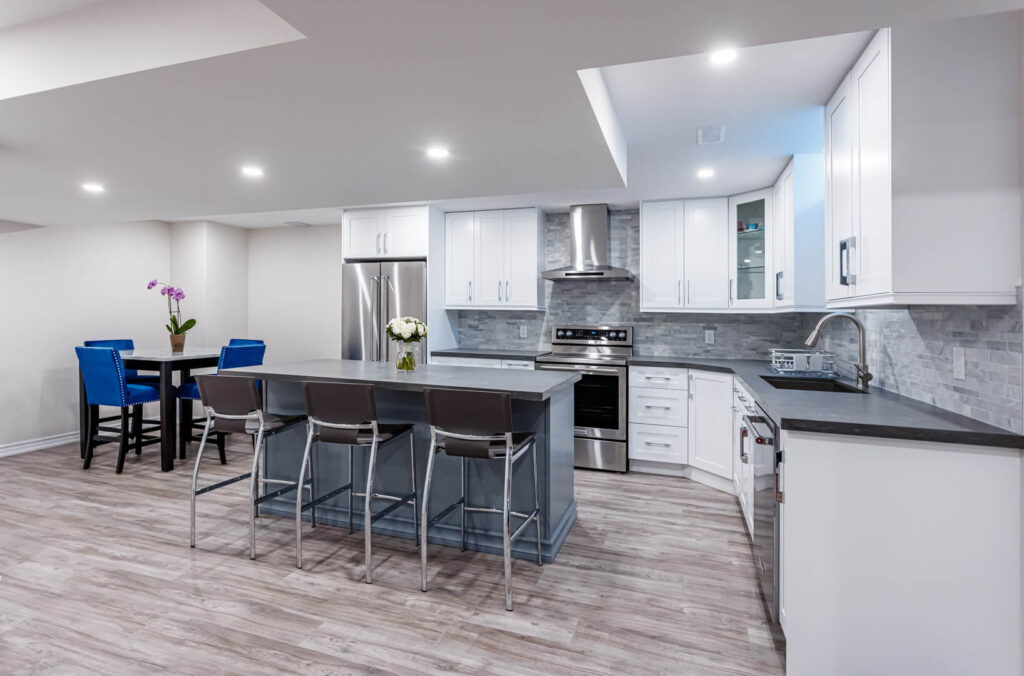 large kitchen renovation with island and chairs and cabinets with countertop