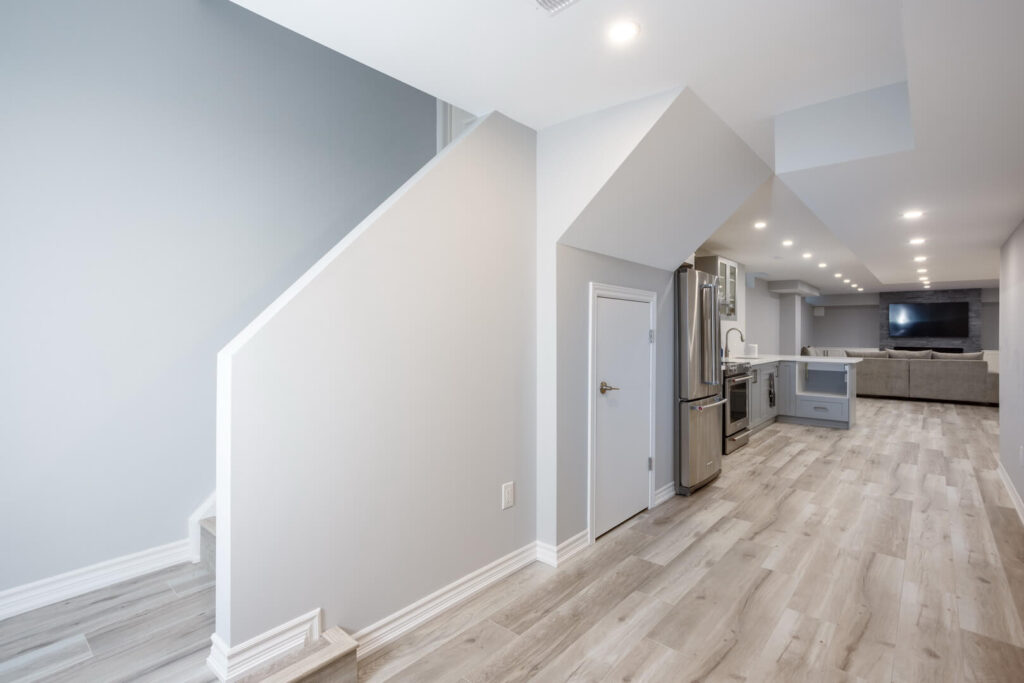 basement stairs with vinyl flooring and kitchen renovation