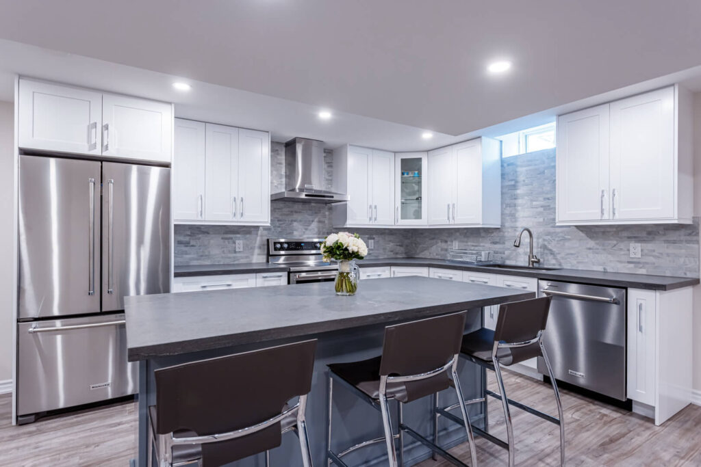 island installed for more kitchen office space with chairs and grey countertop