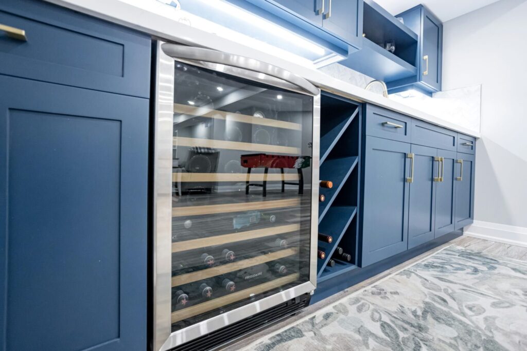 glass door wine bottle storage space with diagonal shelves