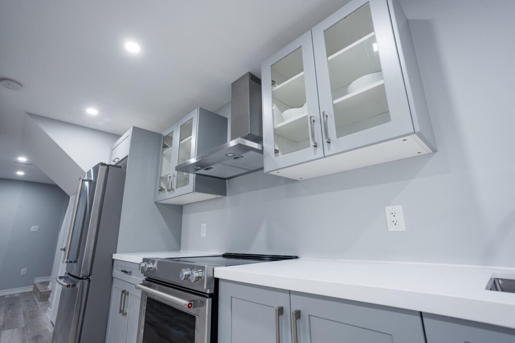 custom Kitchen cabinets with glass door and cersmic countertop