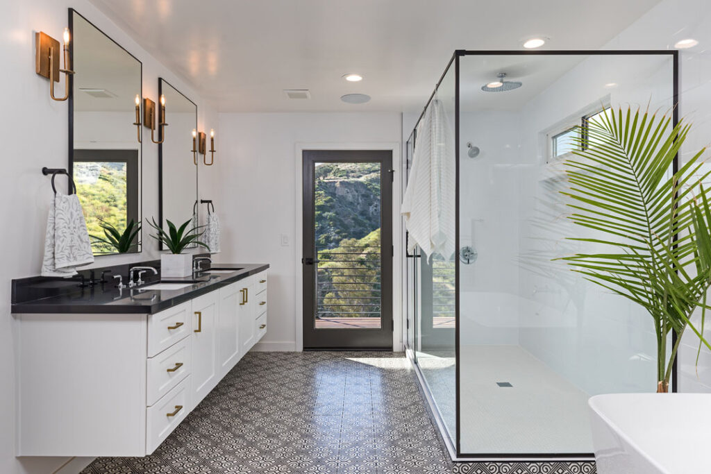 beautiful bathroom renovation with large floating vanity and shower space and flooring