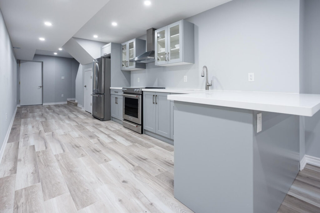 modern small basement kitchen with grey cabinets
