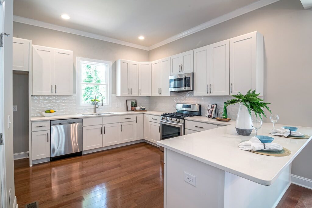 modern complete white kitchen with custom cabinets and countertop