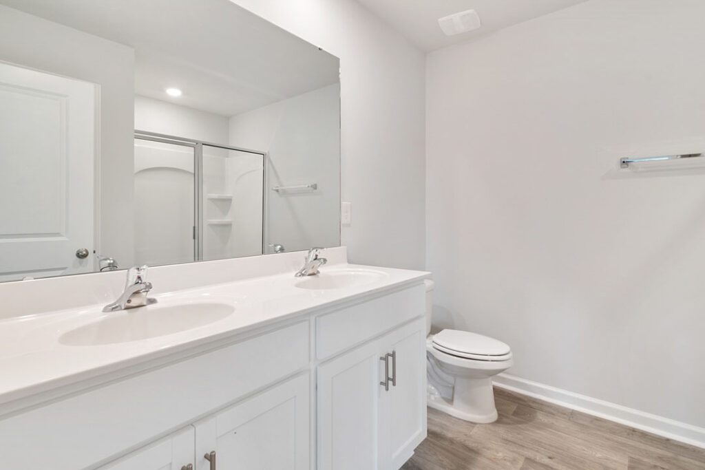 Affordable powder room renovation cost solution with clean white design Minimalist powder room renovation with walk-in shower and white cabinetry