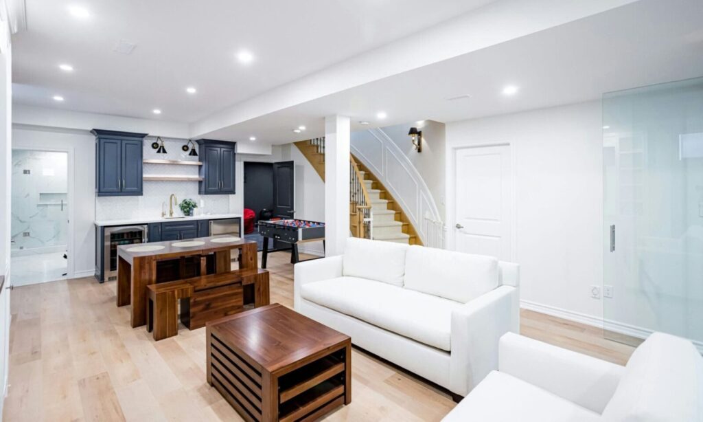 Budget Basement Remodel: finished basement with stairs, bathroom, kitchen and living zone