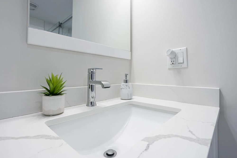 Bathroom paint finish near sink and backsplash