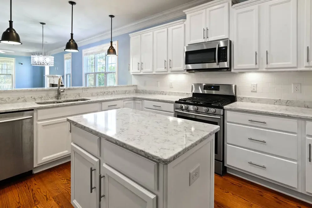 White kitchen cabinets with marble surfaces: King City kitchen renovation services