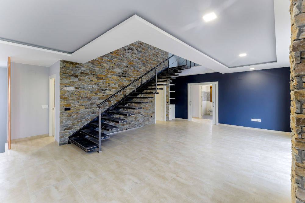L-shaped basement stairs in underpinned basement